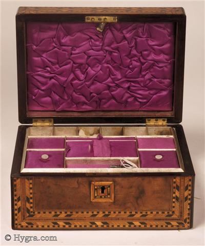 Ref: 639SB:  Figured walnut box with parquetry inlay to the top and front having a n original lift-out tray with supplementary lids covered in purple satin and working lock with key. Circa 1870.  Enlarge Picture